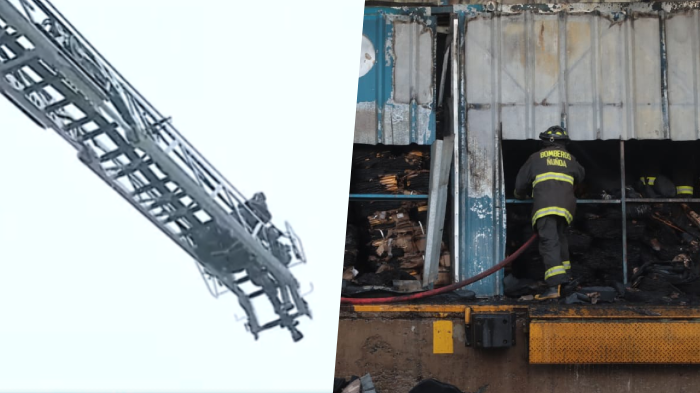 Bomberos intenta arriesgada maniobra para apagar foco de incendio en tres bodegas de Macul