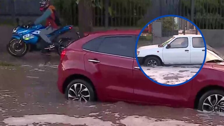 Dos vehículos quedaron atrapados en inundación en San Bernardo: peatones tienen problemas para cruzar